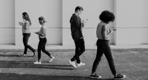 Black and white Image of four people walking